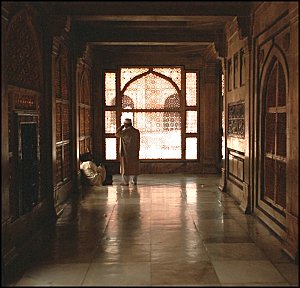 Looking out through a carved stone screen.