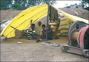 It looks like this guy won the pot, but he is actually holding up a tape casette.